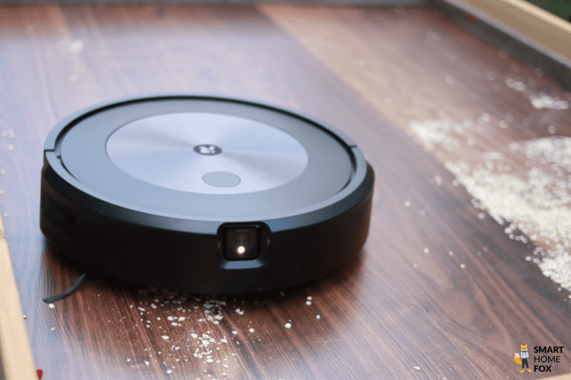 iRobot Roomba robot picks up oatmeal from the floor during the suction test.